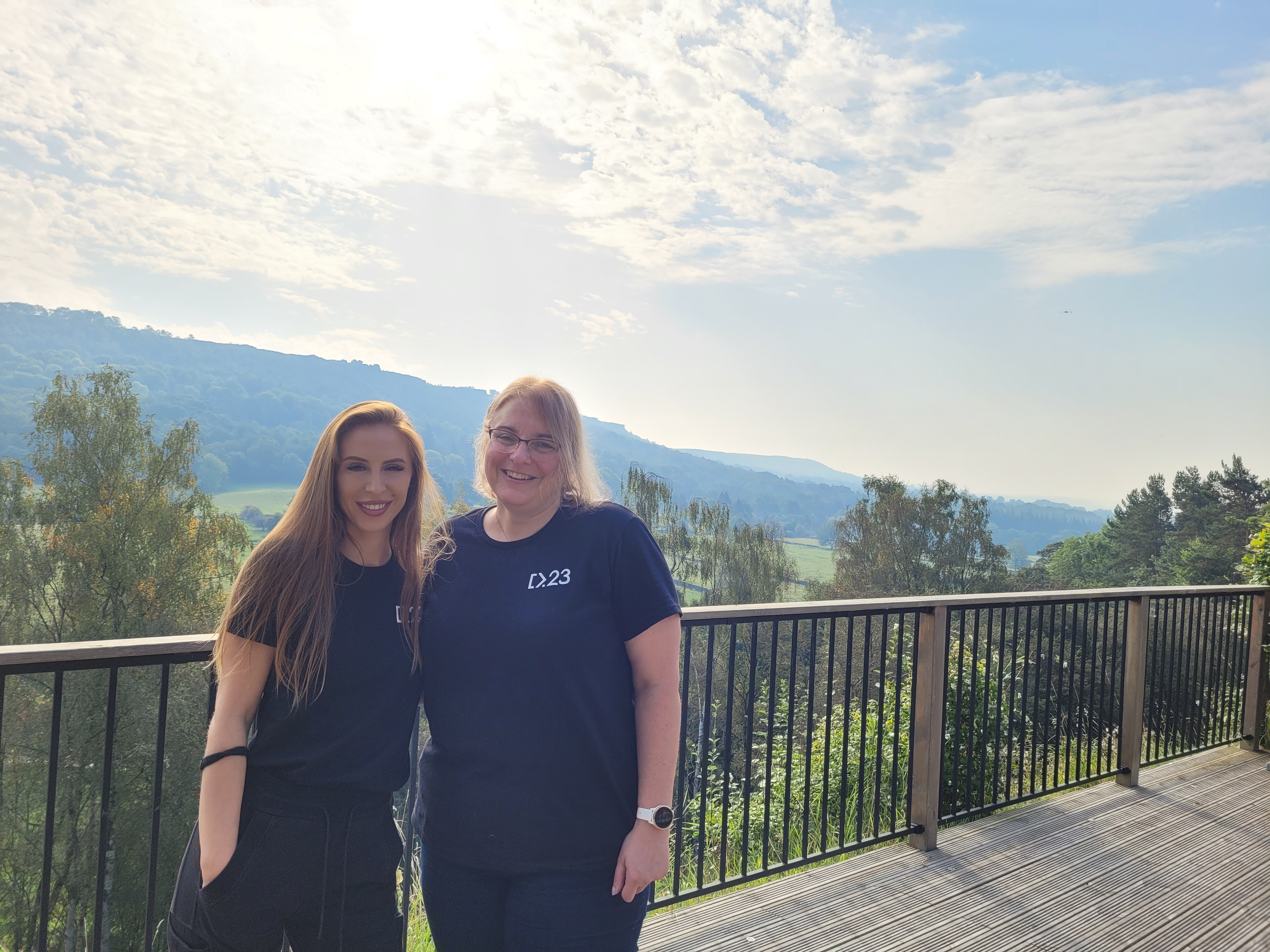 Delia Brunei and Rachel outside on the terrace at CodeCabin