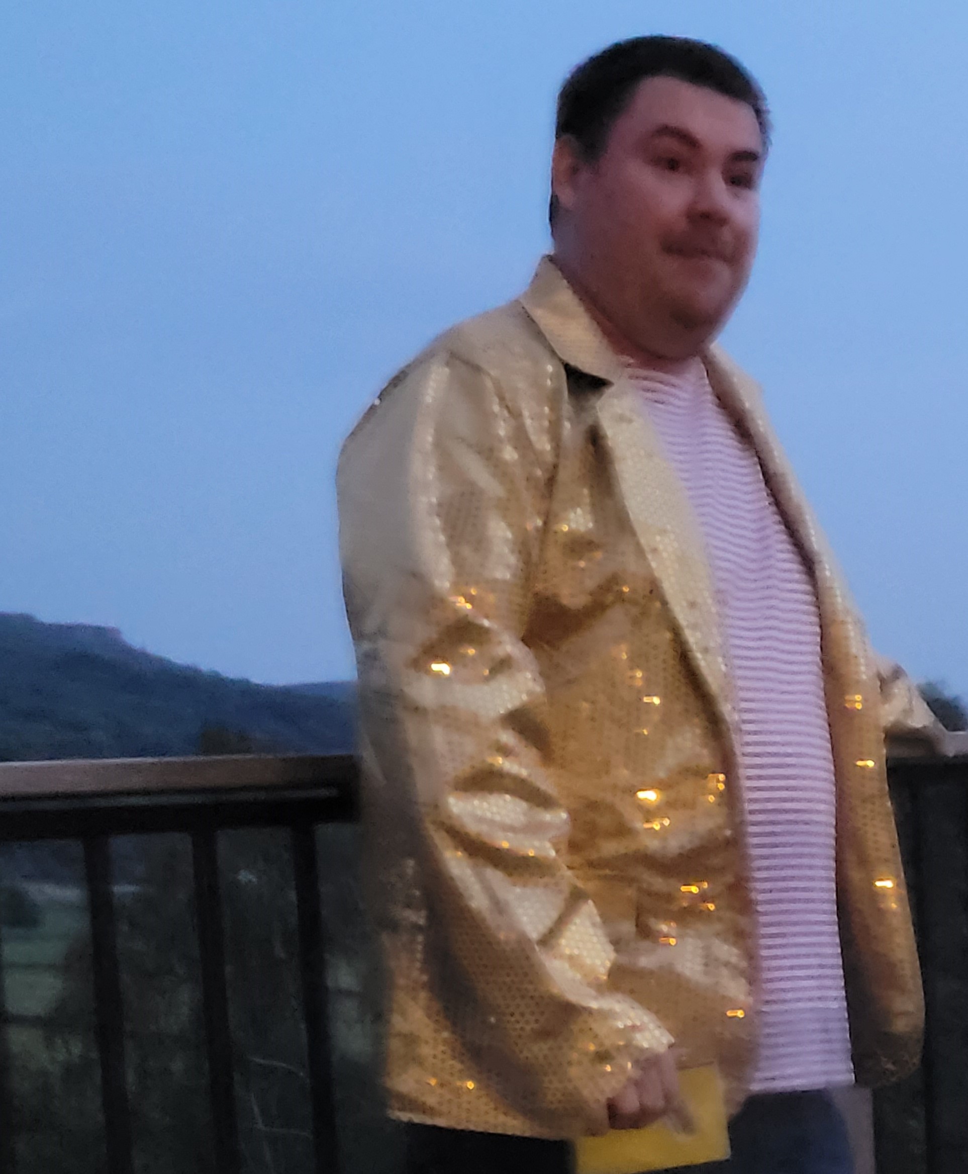 Karl Tynan in his gold sequinned quiz master outfit